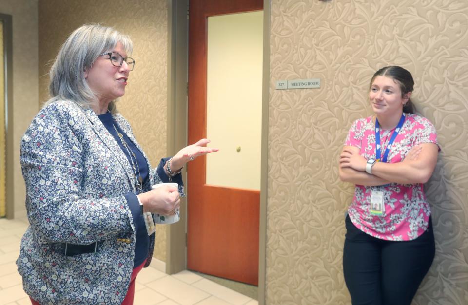 Summit County Domestic Relations Court Judge Katarina Cook talks about changes being made in the court to help domestic violence victims with Mikayla Garofalo, a Victim Assistance employee. Garofalo will staff a new intake office that will be the first stop for people seeking protection orders.