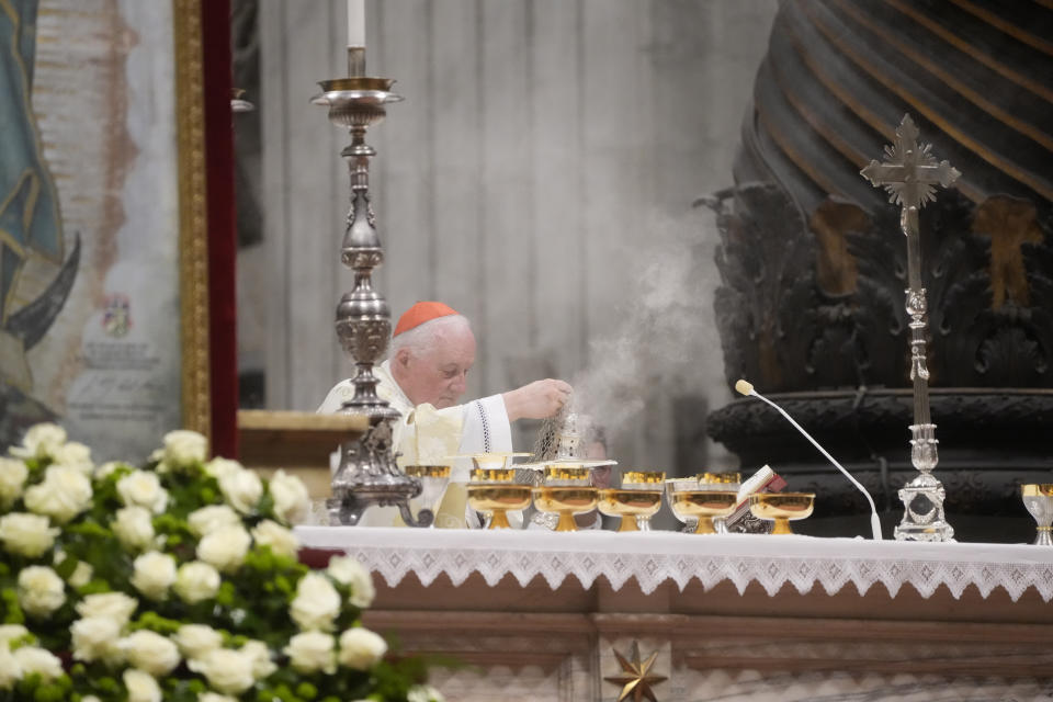 Cardinal Marc Ouellet asperges incense on the altar during a mass in honor of our lady of Guadalupe and presided over by Pope Francis in St. Peter's Basilica at The Vatican, Monday, Dec. 12, 2022. (AP Photo/Gregorio Borgia)