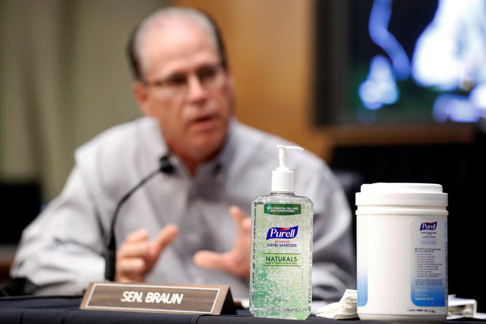 Hand sanitizer sits on a table as Sen. Mike Braun (R-IN) speaks during a Senate Health Education Labor and Pensions Committee hearing on new coronavirus disease (COVID-19) tests, on Capitol Hill in Washington, U.S., May 7, 2020. Andrew Harnik/Pool via REUTERS