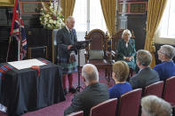 Britain's King Charles III and Camilla, the Queen Consort, attend an official council meeting at the City Chambers in Dunfermline to formally mark the conferral of city status on the former town, ahead of a visit to Dunfermline Abbey to mark its 950th anniversary, in Fife, Scotland, Monday, Oct. 3, 2022. (Andrew Milligan/PA via AP)