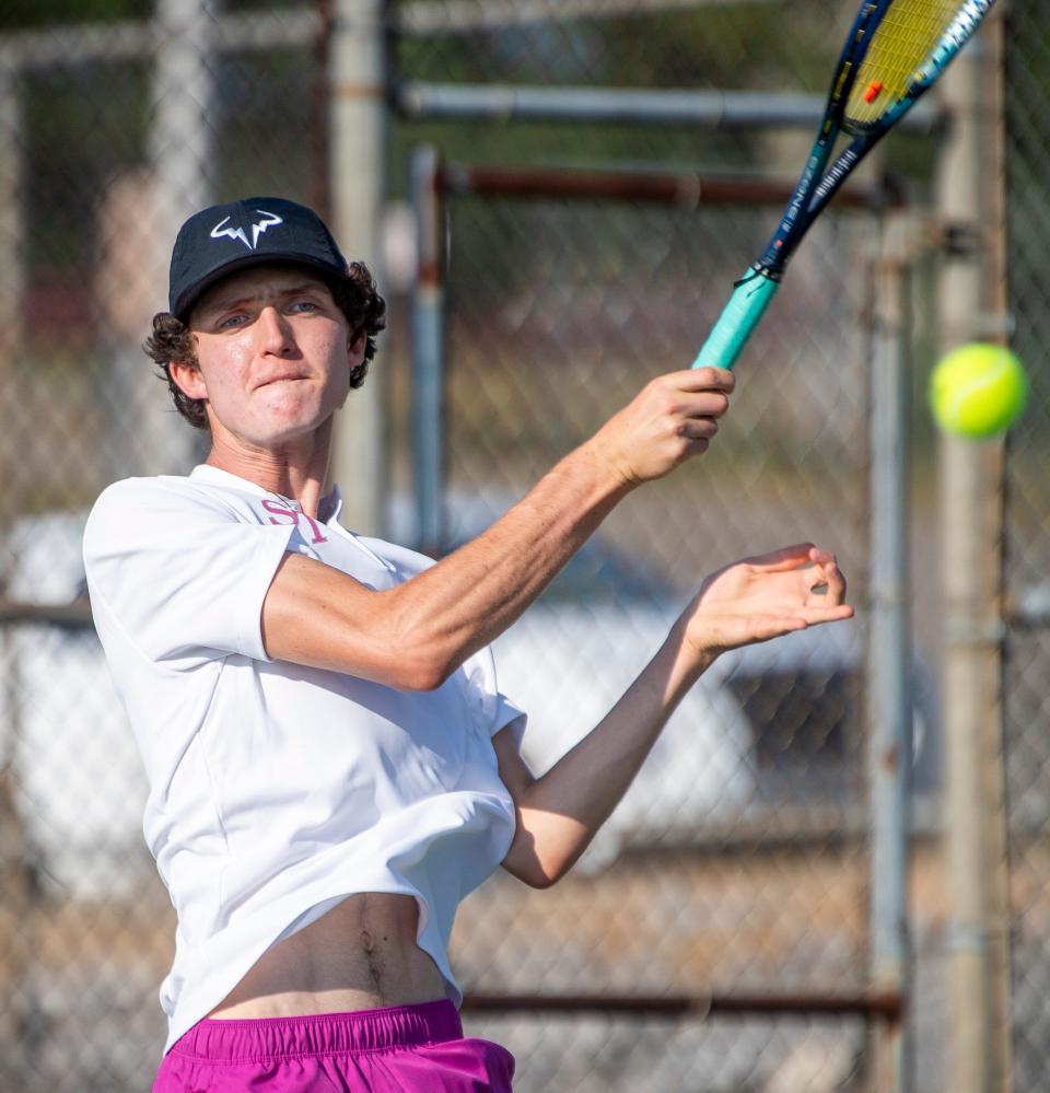 South's David Ciucu makes a return in his match during the North versus South boys tennis match at Bloomington High School North on Tuesday, September 10, 2024.