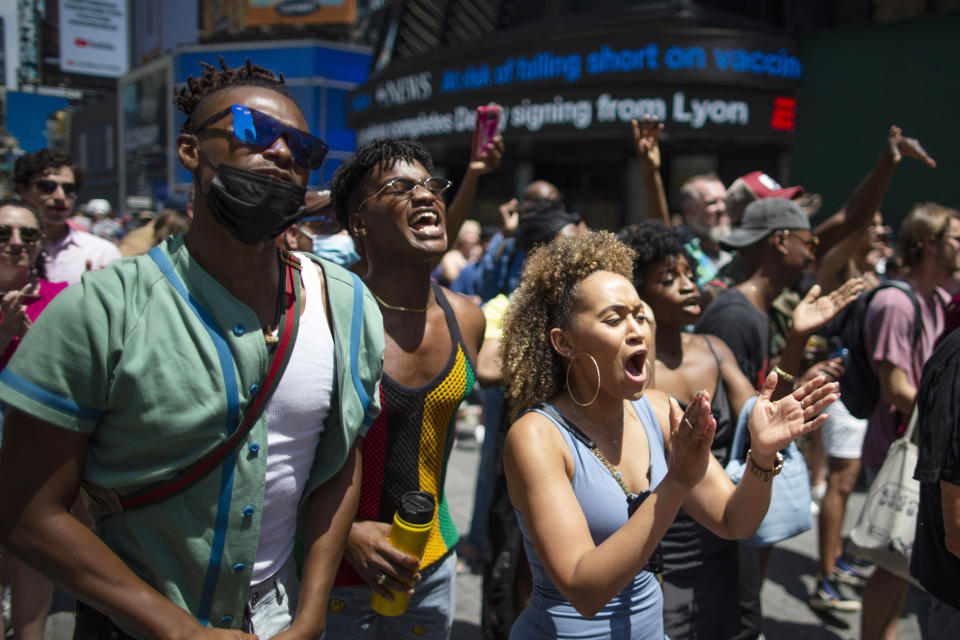 People attend a free outdoor event organized by The Broadway League during Juneteenth celebrations at Times Square on June 19, 2021, in New York City. (Eduardo Munoz Alvarez / AP)