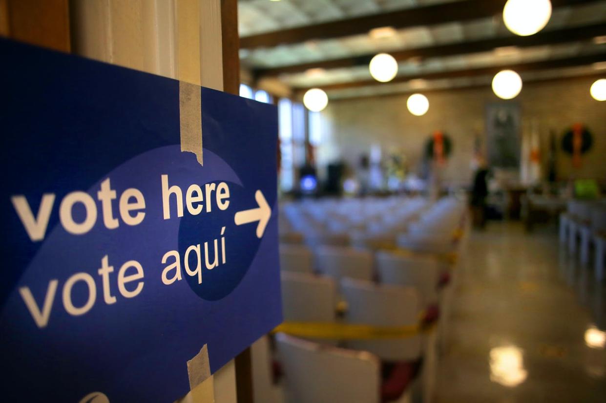 <span class="caption">Voting is well underway in many states. Here, an early voting station in Lincoln, R.I., Oct. 13, 2020. </span> <span class="attribution"><a class="link " href="https://www.gettyimages.com/detail/news-photo/voters-were-directed-to-cast-ballots-inside-at-lincoln-town-news-photo/1229111881?adppopup=true" rel="nofollow noopener" target="_blank" data-ylk="slk:Lane Turner/The Boston Globe via Getty Images;elm:context_link;itc:0;sec:content-canvas">Lane Turner/The Boston Globe via Getty Images</a></span>