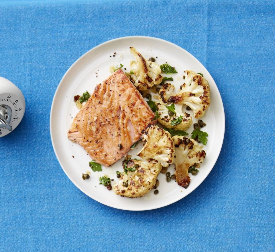 <p>The garlic and capers perform double duty here, seasoning both the salmon and the cauliflower.</p><p><a href="https://www.womansday.com/food-recipes/food-drinks/recipes/a53278/seared-salmon-with-roasted-cauliflower/" rel="nofollow noopener" target="_blank" data-ylk="slk:Get the recipe from Woman's Day »;elm:context_link;itc:0;sec:content-canvas" class="link "> <em>Get the recipe from Woman's Day »</em></a></p>