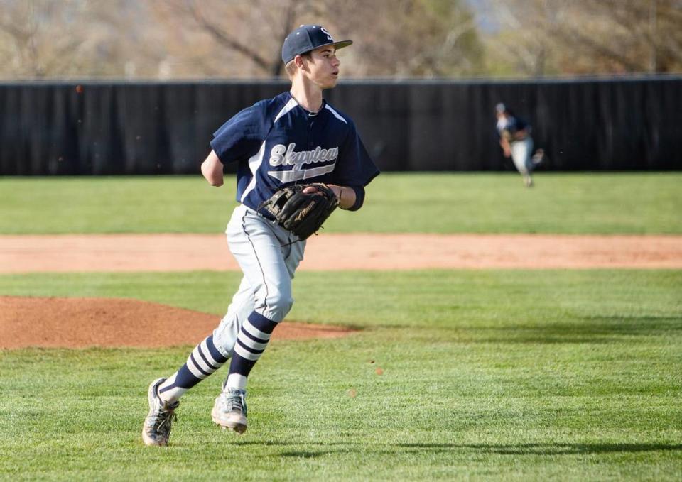 Skyview freshman Grayden Lucas rushes to back up a throw after transferring his glove to his left, and throwing, hand.