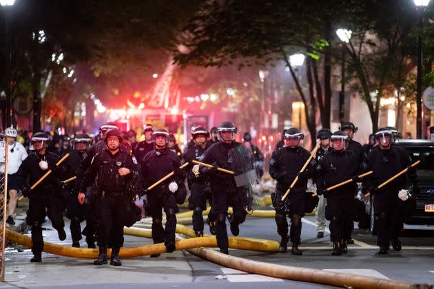 Police push down a street in Philadelphia on May 30, 2020 during a protest over the death of George Floyd.