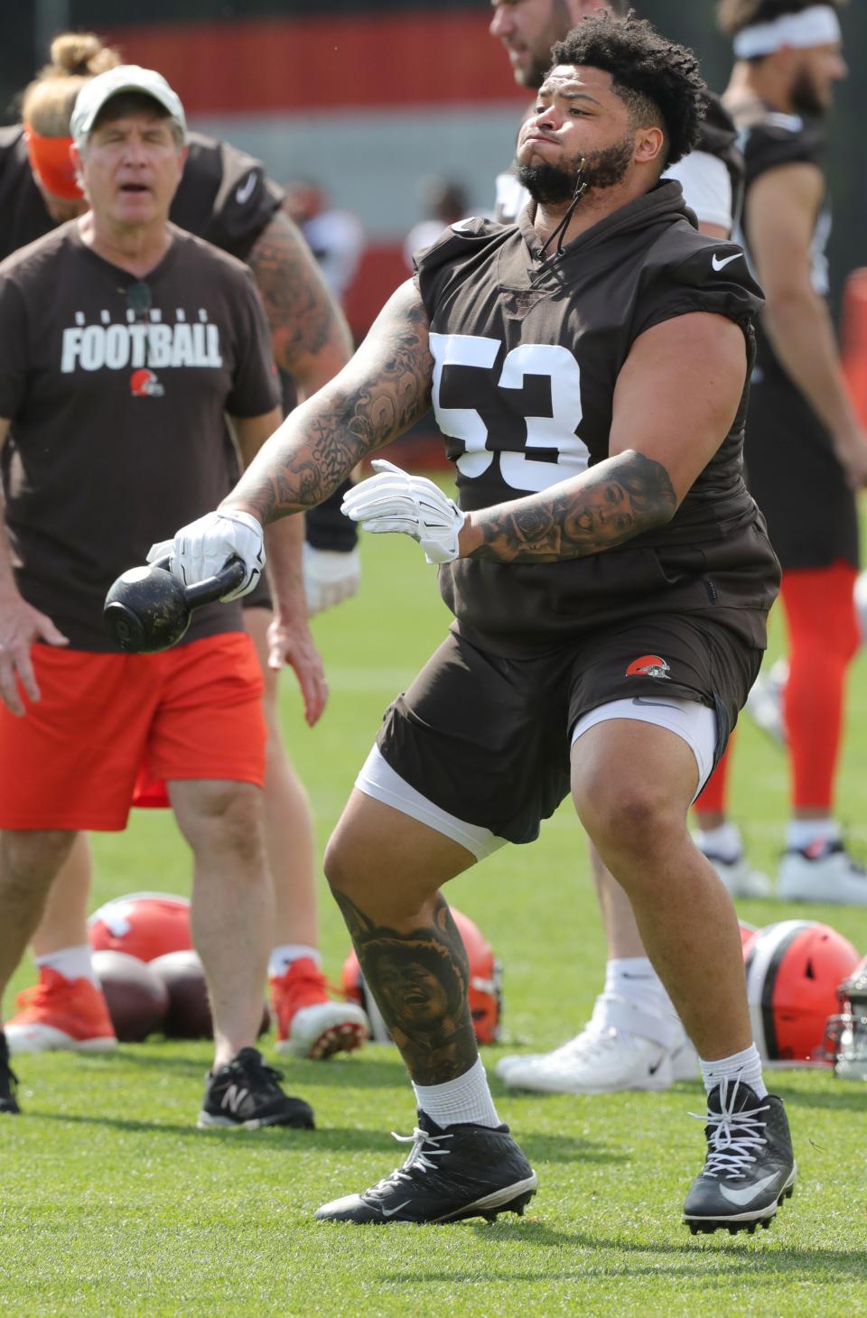 Cleveland Browns center Nick Harris works on drills with coach Bill Callahan during OTA practice on Wednesday, May 25, 2022 in Berea.