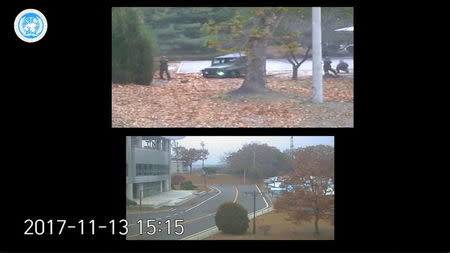 North Korean border guards (top screen) fire at a defecting North Korean soldier in the Demilitarized Zone between North and South Korea, in this still image taken from a video released by the United Nations Command (UNC) on November 22, 2017. United Nations Command/Handout via REUTERS