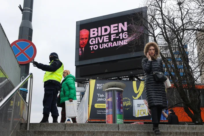 A billboard in Warsaw, Poland, reads: Biden: Give F-16 to Ukraine.