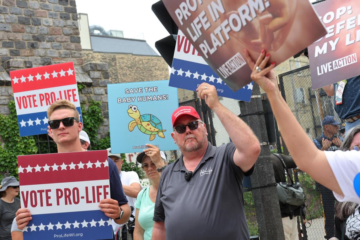 <span>Anti-abortion protesters gather outside the Republican national convention in Milwaukee, Wisconsin, on 15 July 2024.</span><span>Photograph: Michael M Santiago/Getty Images</span>