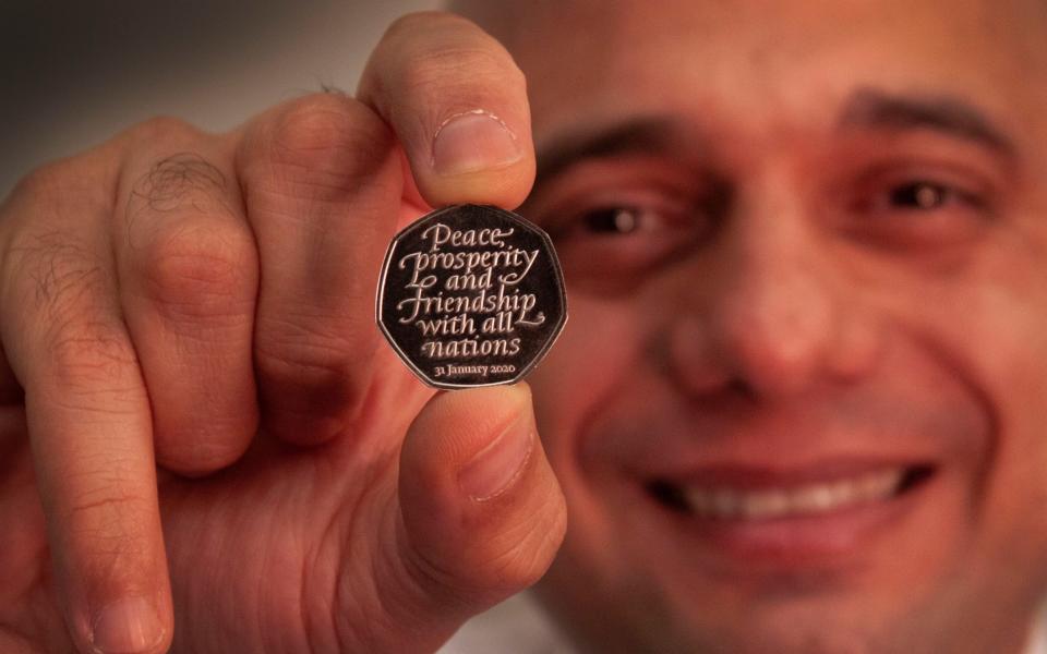 Undated handout photo issued by HM Treasury of Chancellor of the Exchequer Sajid Javid holding the Brexit coin, a 50p bearing the inscription 'Peace, prosperity and friendship with all nations' and the date the UK leaves the EU. PA Photo. Issue date: Sunday January 26, 2020. Around 3 million Brexit coins will enter banks, Post Offices and shops nationwide from Friday 31 January, with a further 7 million entering circulation later this year. See PA story POLITICS Brexit Coin. Photo credit should read: HM Treasury/PA Wire NOTE TO EDITORS: This handout photo may only be used in for editorial reporting purposes for the contemporaneous illustration of events, things or the people in the image or facts mentioned in the caption. Reuse of the picture may require further permission from the copyright holder. - PA/PA