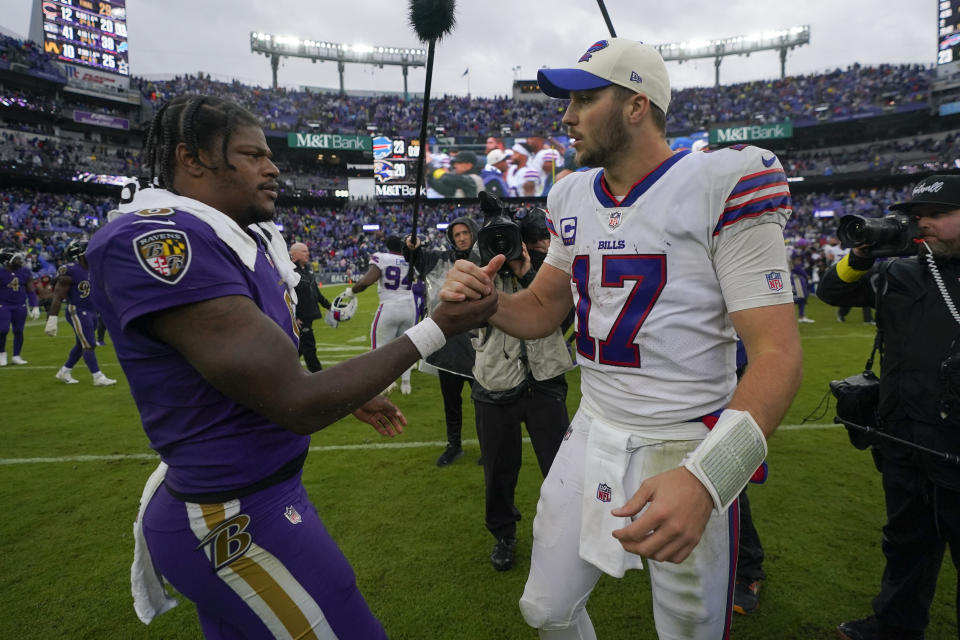 Baltimore Ravens quarterback Lamar Jackson, left, and Buffalo Bills quarterback Josh Allen (17) shake hands after an NFL football game Sunday, Oct. 2, 2022, in Baltimore. The Bills won 23-20. (AP Photo/Julio Cortez)