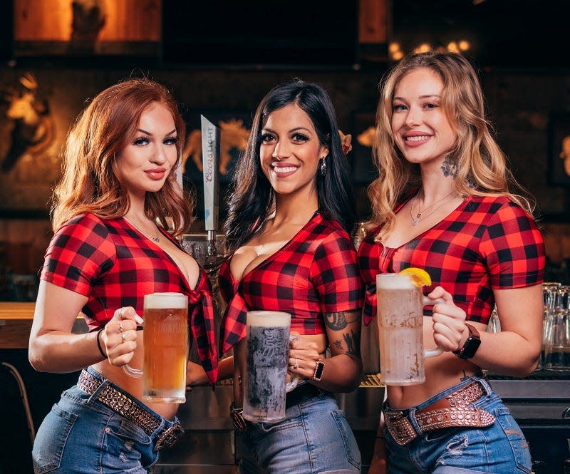 This is a stock photo of the flannel shirt-attired "Twin Peaks Girl" servers at the Twin Peaks restaurant chain. The Texas-based company plans to open its first Volusia-Flagler area location in mid- to late March 2023 at the new Cornerstone Exchange retail center in Daytona Beach's LPGA area.