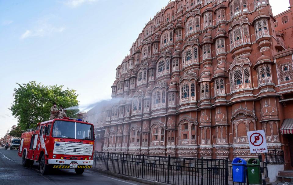 A modified municipal corporation vehicle is used to sanitise an area near Hawa Mahal, as coronavirus cases surge in Jaipur, Wednesday, 21 April 2021.