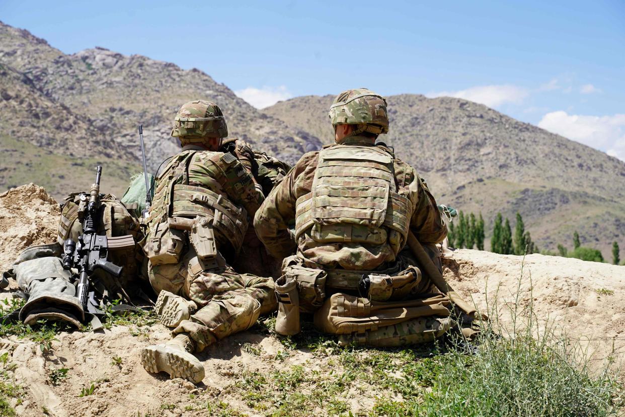 US soldiers look out over hillsides during a visit of the commander of US and NATO forces in Afghanistan General Scott Miller at the Afghan National Army (ANA) checkpoint in Nerkh district of Wardak province on June 6, 2019.