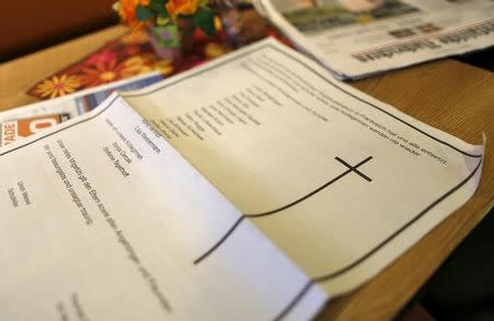 A death notice for the 16 students and two teachers of the Joseph-Koenig-Gymnasium high school is seen in a regional newspaper in Haltern am See, March 26, 2015. REUTERS/Ina Fassbender