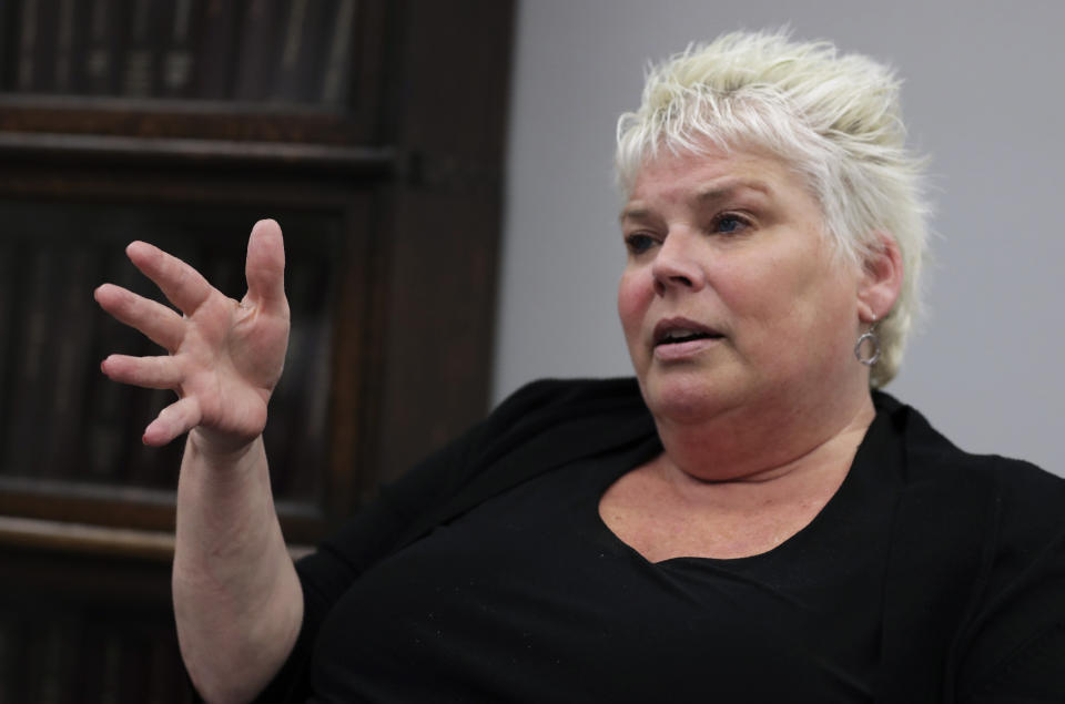 In this Tuesday June 4, 2019 photograph, attorney Rosemary Scapicchio explains details in the case of her client Sean Ellis at her law office in Boston. Civil liberty groups and reform-minded district attorneys are pushing to bring greater transparency to the process of highlighting police officers who have committed misconduct and could undermine criminal cases if they took the stand. (AP Photo/Charles Krupa)