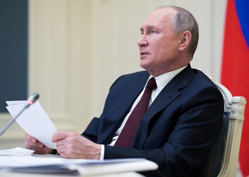 FILE PHOTO: Russian President Vladimir Putin takes part in a virtual conference in Moscow