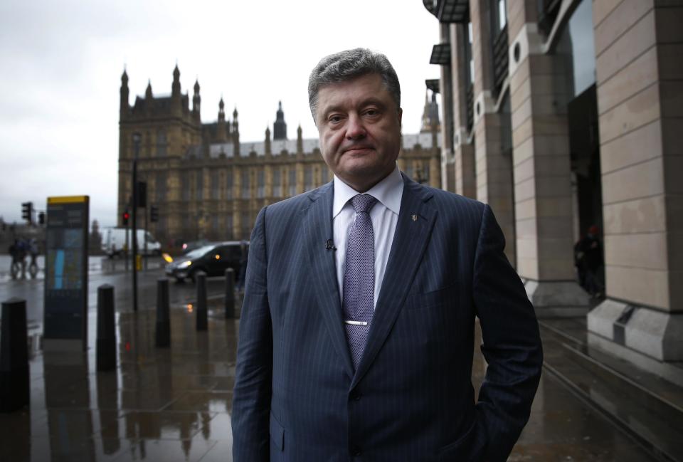 Ukrainian politician Petro Poroshenko poses for photographers after meetings with British parliamentarians in central London, Wednesday, March 26, 2014. (AP Photo/Lefteris Pitarakis)