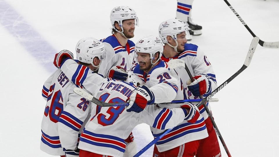 Feb 17, 2023;  Edmonton, Alberta, CAN;  The New York Rangers celebrate a shoot-out winning goal scored by forward Alexis Lafreniere (13) against the Edmonton Oilers at Rogers Place.