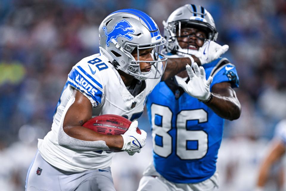 Antoine Green of the Detroit Lions stiff-arms Gary Jennings of the Carolina Panthers during the first half of a preseason game at Bank of America Stadium on August 25, 2023 in Charlotte, North Carolina.