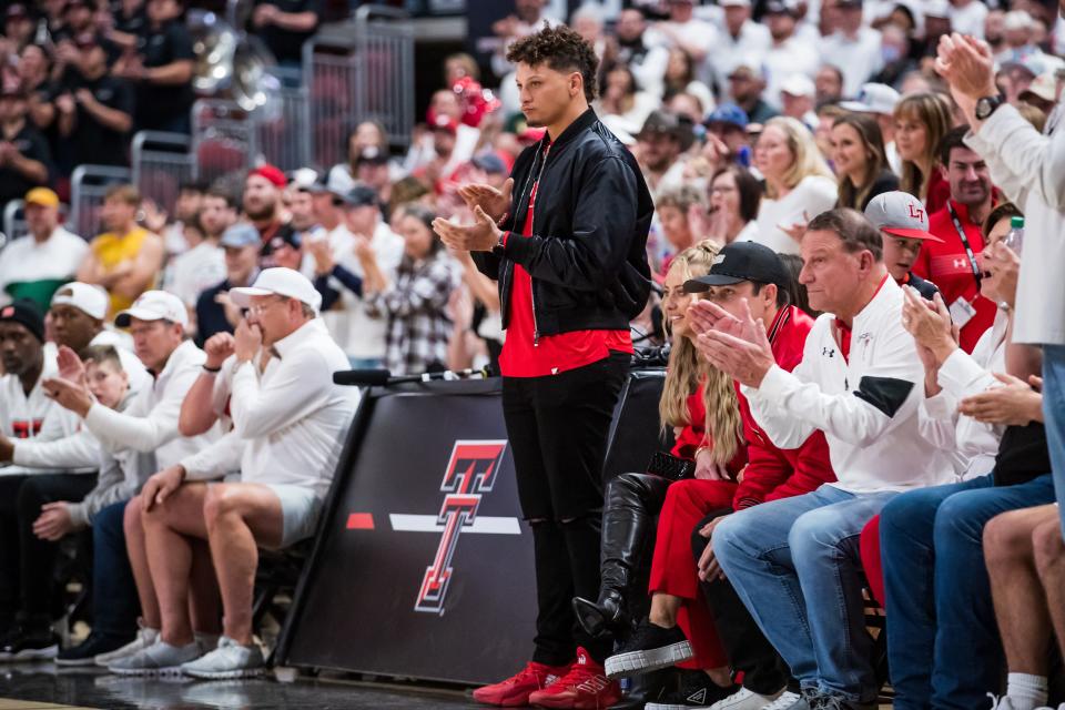 LUBBOCK, TEXAS - FEBRUARY 16: Quarterback Patrick Mahomes of the Kansas City Chiefs claps during the first half of the college basketball game between the Texas Tech Red Raiders and the Baylor Bears at United Supermarkets Arena on February 16, 2022 in Lubbock, Texas. (Photo by John E. Moore III/Getty Images)