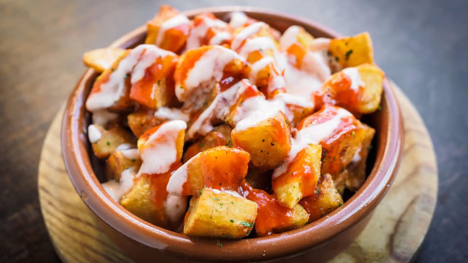 Crispy patatas bravas are served with a spicy sauce. - Erlantz Perez Rodriguez/Alamy Stock Photo