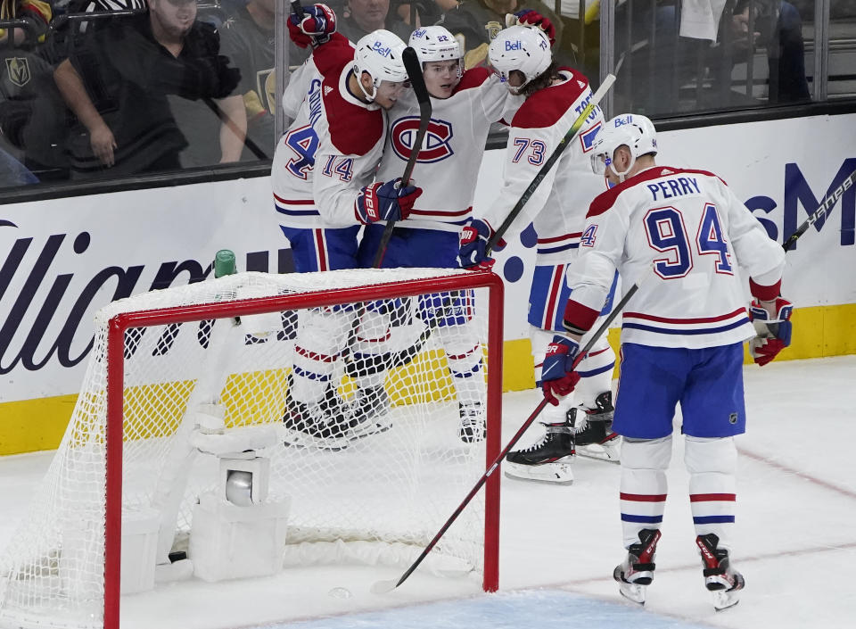 Montreal Canadiens players celebrate after Montreal Canadiens right wing Cole Caufield, second from left, scored against the Vegas Golden Knights during the second period in Game 1 of an NHL hockey Stanley Cup semifinal playoff series Monday, June 14, 2021, in Las Vegas. (AP Photo/John Locher)