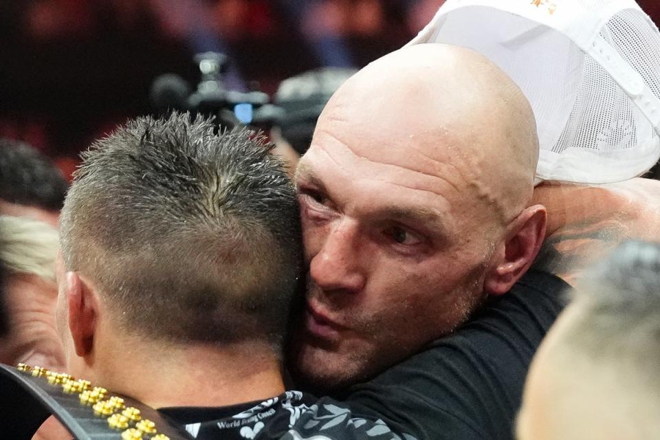 Oleksandr Usyk is embraced by Tyson Fury (Nick Potts/PA Wire)