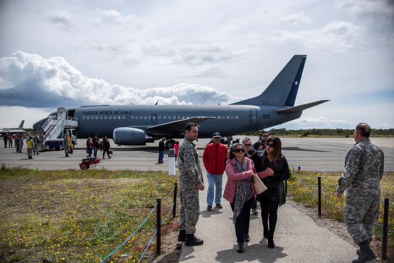 Relatives of passengers on the Hercules C-130 aircraft of Chile's Air Force that crashed arrive at an Air Force base in Punta Arenas city
