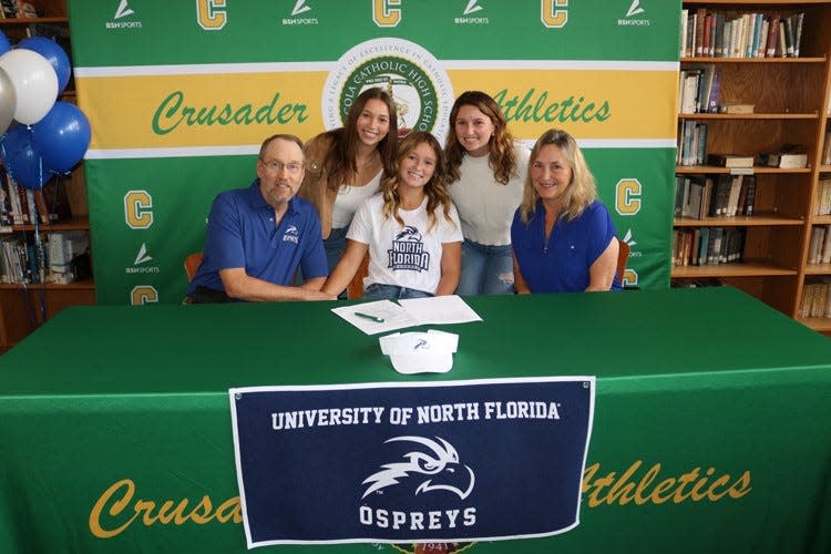 Three-time PNJ Girls Tennis Player of the Year Gabby Goyins (middle, sitting) recently signed her letter of intent to play at the University of North Florida.