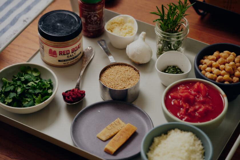 ALTADENA, CA - FEBRUARY 29, 2024: Dishes and cooking of soup in Michelle Huneven's kitchen.