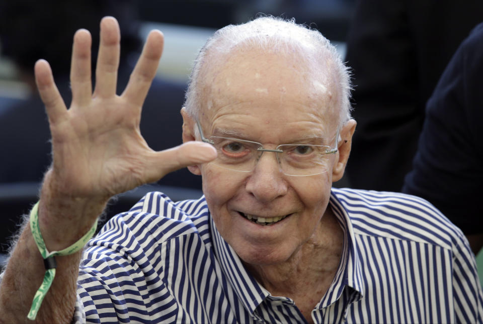 FILE - Former Brazilian player and head coach Mario Zagallo arrives to attend the World Cup final soccer match between Germany and Argentina at the Maracana Stadium in Rio de Janeiro, Brazil, July 13, 2014. Zagallo, who reached the World Cup final a record five times, winning four, as a player and then a coach with Brazil, has died. He was 92. Brazilian soccer confederation president Ednaldo Rodrigues said in a statement in the early hours of Saturday, Jan. 5, 2024, confirming Zagallo's death that Zagallo “is one of the biggest legends” of the sport. (AP Photo/Hassan Ammar, File)