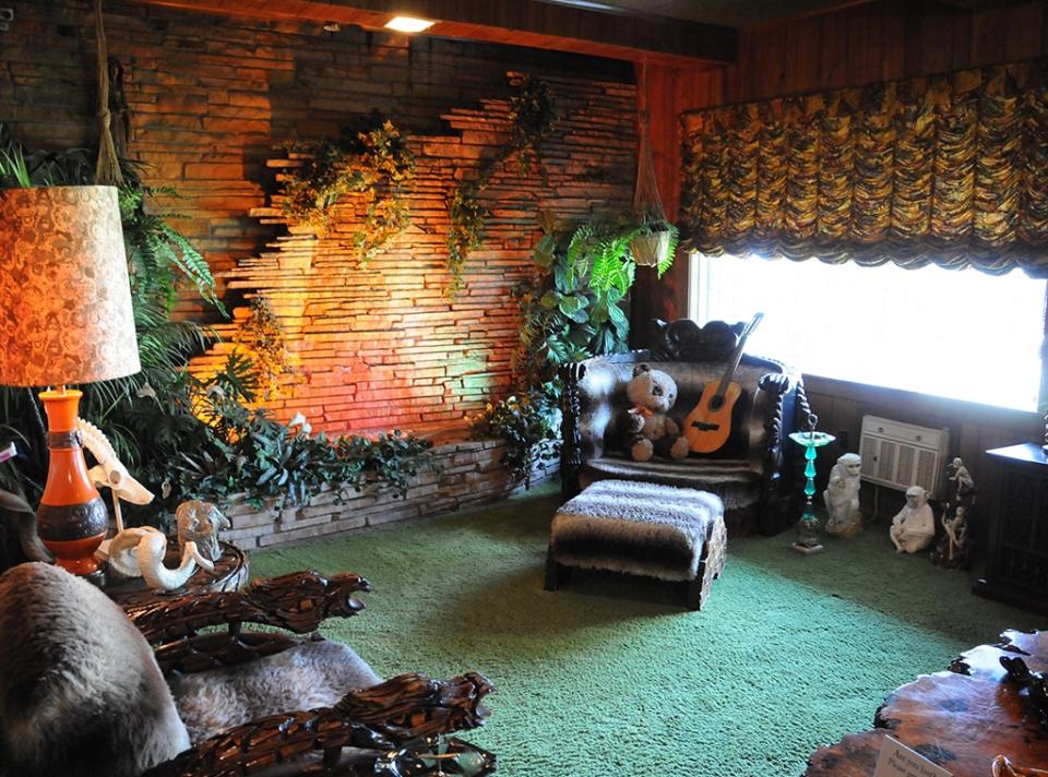 <p>In addition to five staircases and three fireplaces, the home also has a billIards room and a lair that Elvis referred to as "The Den". Complete with a waterfall, wooden walls, a grass shag carpet and plastic foliage, fans began calling it "the Jungle Room" when Graceland was opened to public visitors in 1982.</p> <p>According to Rolling Stone, Elvis turned the oasis into a temporary studio to record 16 songs that were released on 1976's <em>Elvis Presley Boulevard, Memphis, Tennessee</em>, and 1977's <em>Moody Blue</em>.</p>