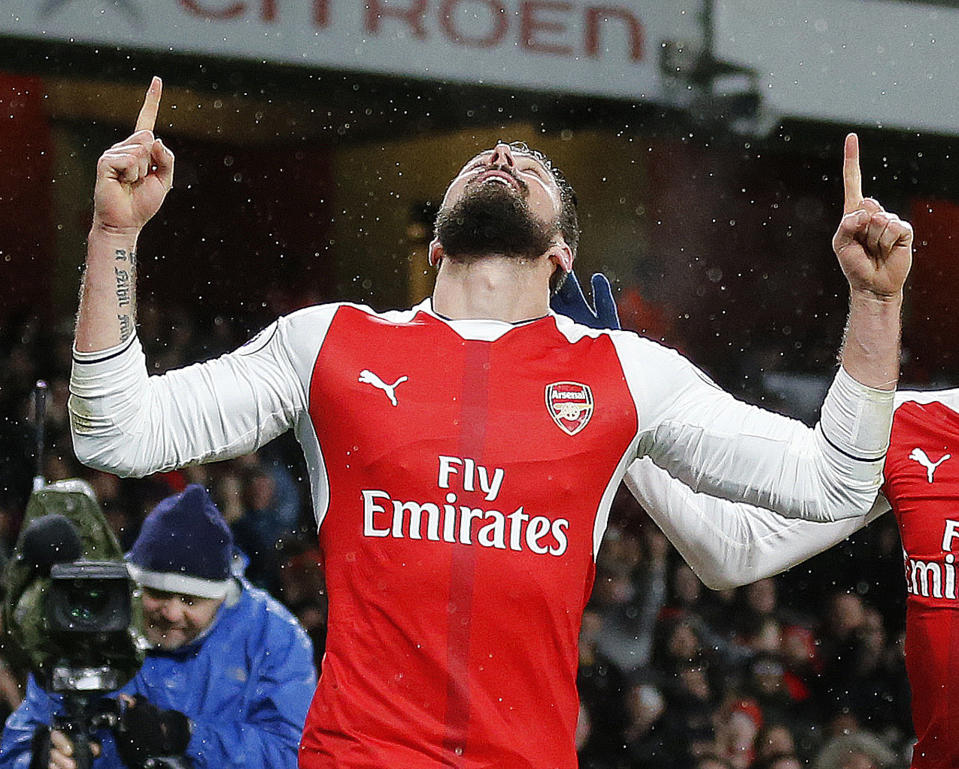 Arsenal's Olivier Giroud celebrates after scoring during the English Premier League soccer match between Arsenal and Crystal Palace at the Emirates stadium in London, Sunday, Jan. 1, 2017.(AP Photo/Frank Augstein)