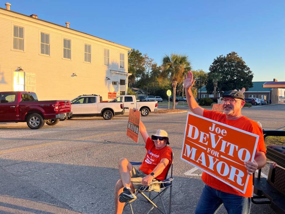 Joe DeVito, right, campaigns along Paris Avenue in Port Royal just hours before the polls closed Tuesday evening, joined by supporter Scot Clark.