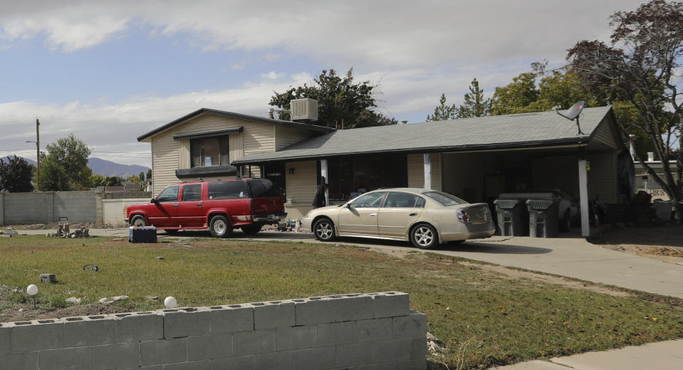 File - In this Oct. 9, 2019, file photo, a Utah home that was owned by an Arizona elected official charged with human smuggling in an adoption fraud scheme is shown in West Valley City, Utah. Authorities say Maricopa County Assessor Paul Petersen used homes like this one to lodge pregnant women from Marshall Islands who were offered money to come to the U.S. to give up their children for adoption. The president of the Republic of the Marshall Islands is applauding U.S. authorities for arresting an Arizona elected official accused of running an illegal adoption scheme involving pregnant Marshallese women. President Hilda Heine issued a statement Thursday, Oct. 17, 2019, saying people like Maricopa County Assessor Paul Petersen have been inducing Marshallese women for too long. (AP Photo/Rick Bowmer, File)