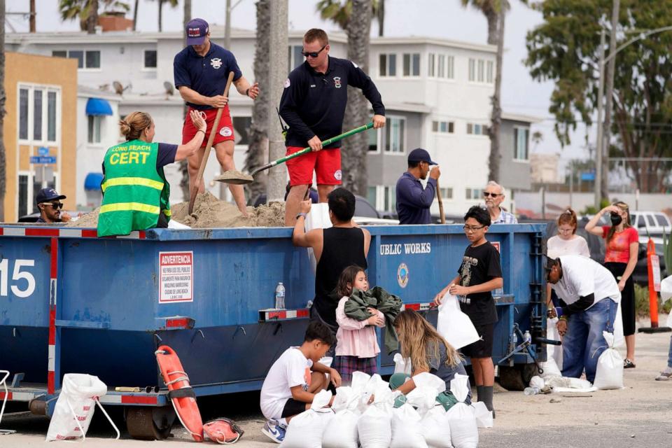 PHOTO: Long Beach Lifeguards fill up sandbags for residents ahead of Hurricane Hilary in Long Beach, Calif., Aug. 19, 2023. (Damian Dovarganes/AP)