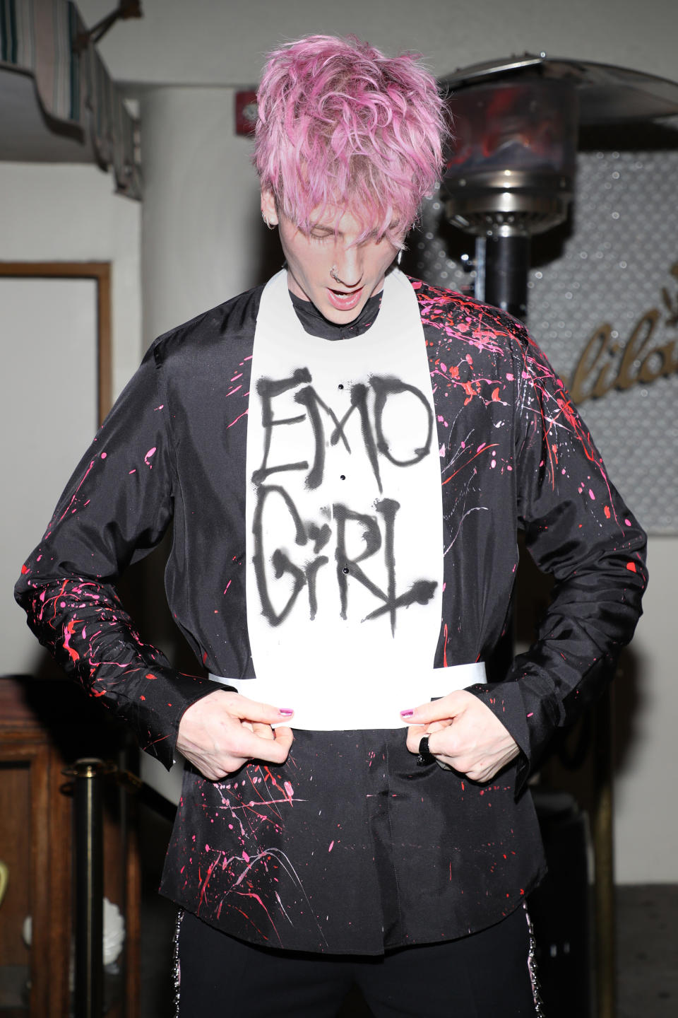 Machine Gun Kelly wearing a shirt that says "Emo Girl."