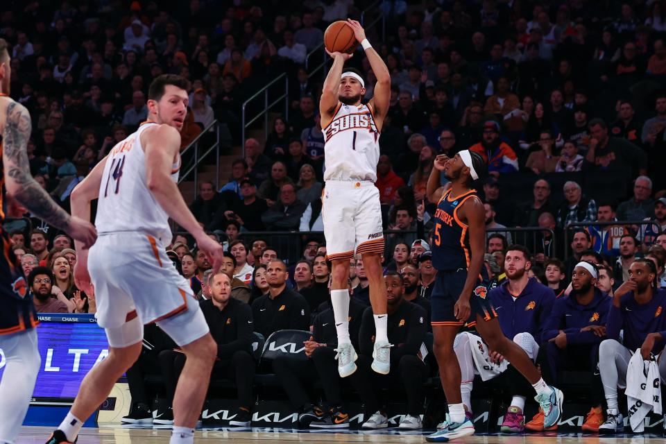 Devin Booker #1 of the Phoenix Suns shoots during the first quarter of the game against the New York Knicks at Madison Square Garden on Nov. 26, 2023, in New York City, New York.