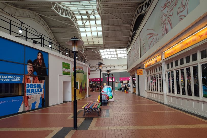 The inside of the centre with its brick flooring and street lamps