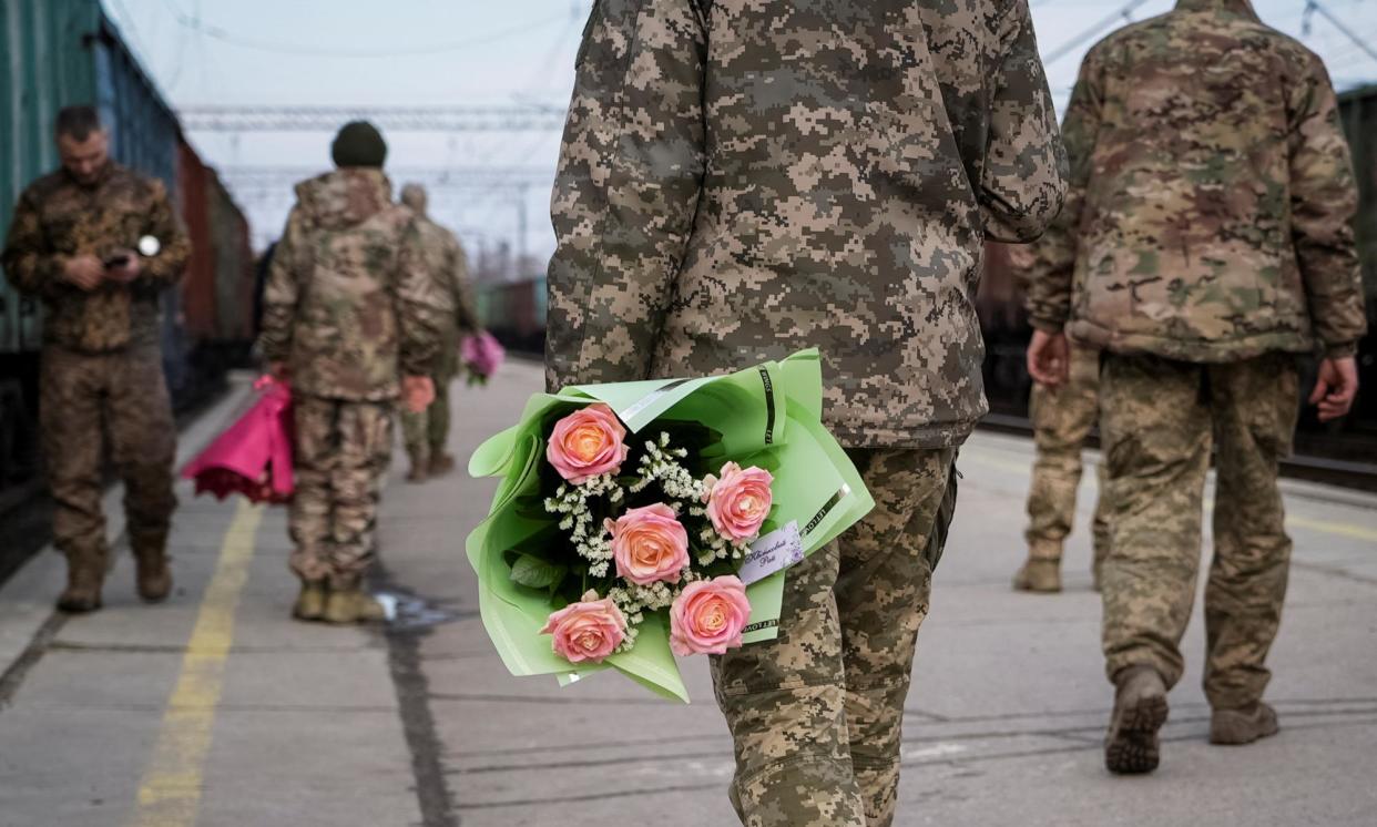 <span>Servicemen waiting for the train from Kyiv in Kramatorsk, Ukraine, 14 February 2024. <br></span><span>Photograph: Reuters</span>