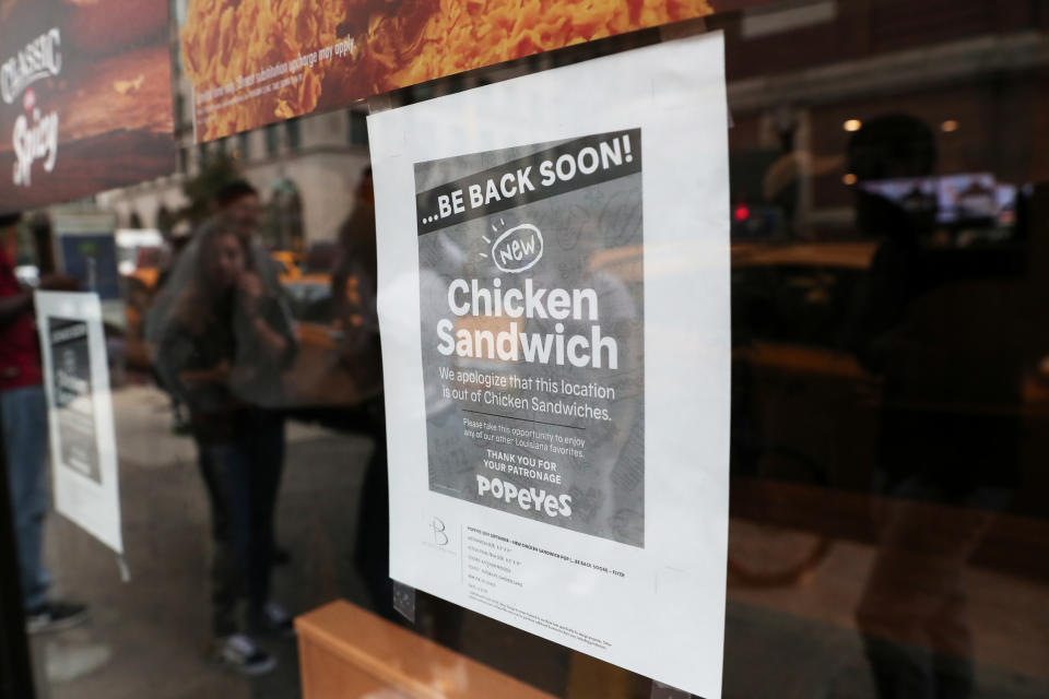 A sign posted outside Popeyes Louisiana Kitchen states that the restaurant is out of their new chicken sandwiches in New York, U.S., August 23, 2019. REUTERS/Shannon Stapleton