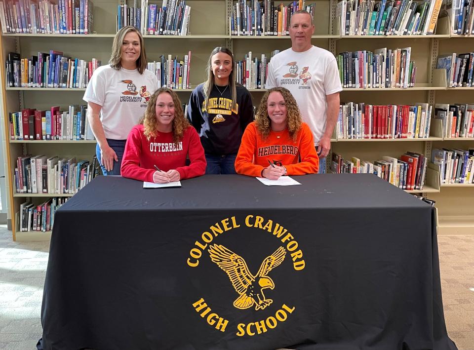 Colonel Crawford's Rylee and Reagan Ritzhaupt commit to further their volleyball careers at Otterbein University and Heidelberg University. Their parents Kendra and Sean, along with coach Taylor Heiby, stand behind.