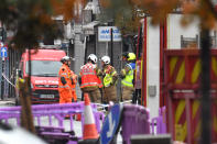 Emergency services at the scene of a suspected gas explosion on King Street in Ealing, west London. Rescuers are involved in a "complex" search for anyone who may still be inside the collapsed building.