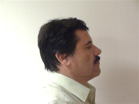 Mexican drug kingpin Joaquin "Shorty" Guzman is seen during his detention in Mexico City, in this undated handout photo provided by Mexico's Attorney General's office (PGR) on February 25, 2014. REUTERS/PGR/Handout via Reuters