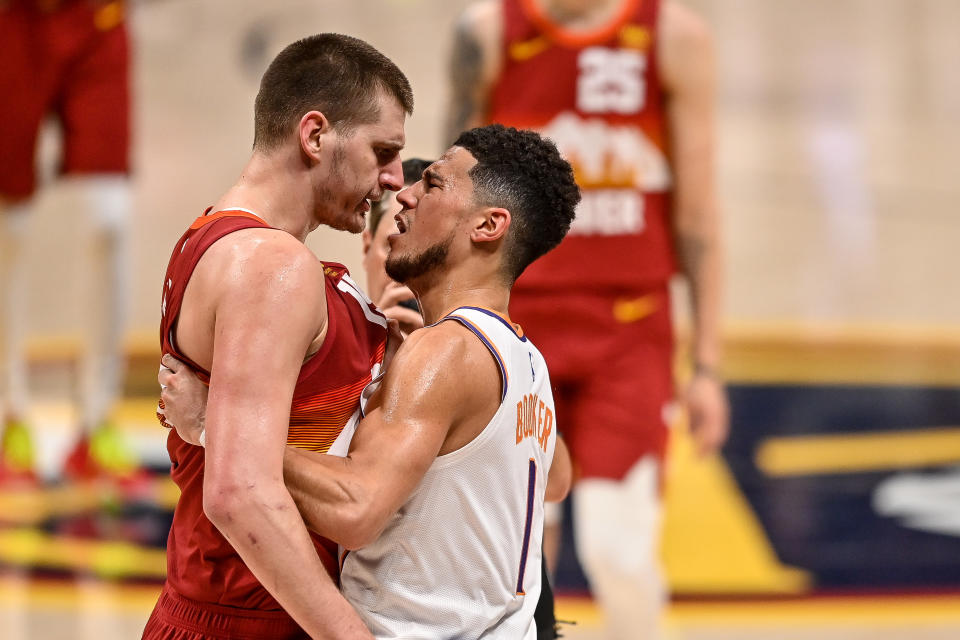 Things got heated between Denver Nuggets center Nikola Jokic and Phoenix Suns guard Devin Booker when they met in the 2021 NBA playoffs. (Dustin Bradford/Getty Images)