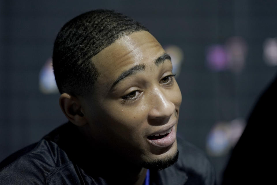 Kansas' Dajuan Harris Jr. talks to the media during the NCAA college Big 12 men's basketball media day Wednesday, Oct. 18, 2023, in Kansas City, Mo. (AP Photo/Charlie Riedel)