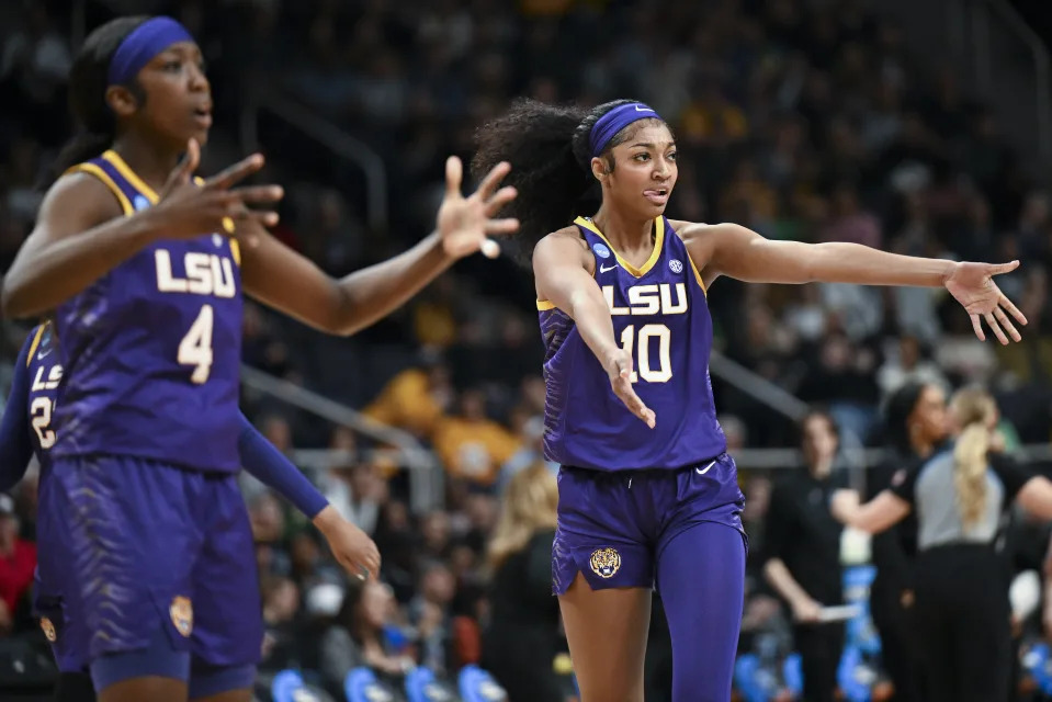 LSU forward Angel Reese (10) and guard Flau'jae Johnson (4) react during the second quarter of a Sweet Sixteen round college basketball game against the UCLA during the NCAA Tournament, Saturday, March 30, 2024, in Albany, N.Y. (AP Photo/Hans Pennink)