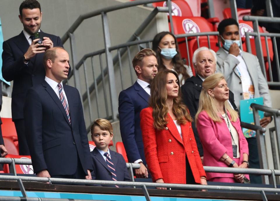 British Prince William, Duke of Cambridge, his wife Kate, Duchess of Cambridge, and their eldest son Prince George attend the Euro 2020 soccer match round of 16 between England and Germany at Wembley stadium in London, Tuesday, June 29, 2021. - Credit: AP
